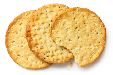 Three golden cheese crackers on white.