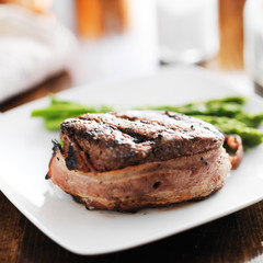 bacon wrapped beef steak filet with asparagus side