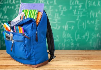 School. Backpack with school supplies including, notebooks, pens