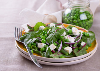 Salad with green peas, beans, red onion and feta cheese