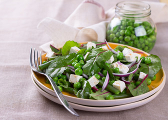 Salad with green peas, beans, red onion and feta cheese
