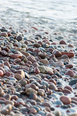 Stones on beach and sea water