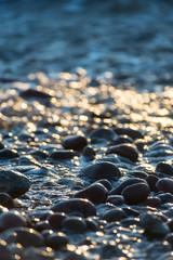 Stones on beach and sea water
