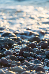 Stones on beach and sea water