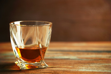 Whiskey on wooden background