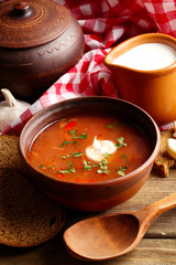 Ukrainian beetroot soup - borscht in bowl and pot,
