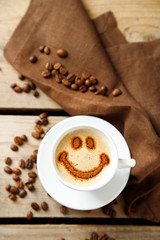 Cup of coffee on old wooden table
