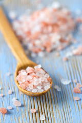 himalayan pink salt on wooden surface