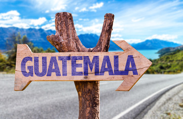 Guatemala wooden sign with road background