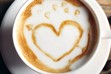Cup of coffee latte art, closeup