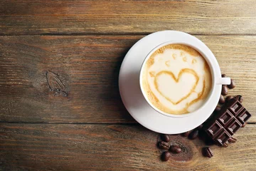 Papier Peint photo autocollant Bar a café Cup of coffee latte art with grains and chocolate