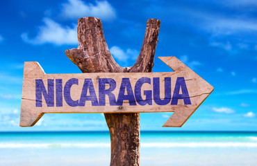 Nicaragua wooden sign with beach background