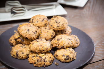 Cookies with raisins on wooden table