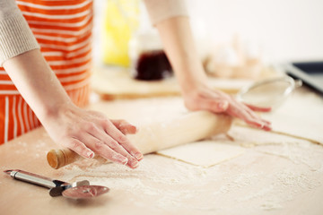 Making croissant cookies. Rolling dough.