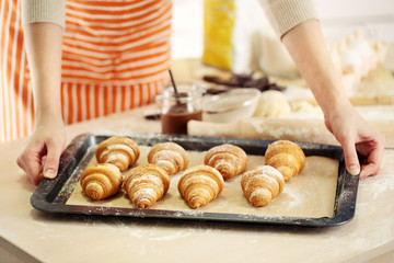 Baking croissant cookies.