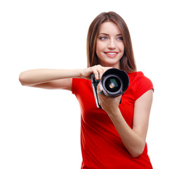 Young female photographer taking photos isolated on white