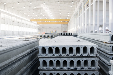 Stack of reinforced concrete slabs in a factory workshop
