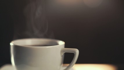 HD video of classic coffee cup with steam rising