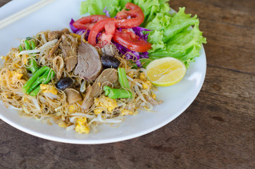 Thai style stir fried rice noodle with duck and vegetable 