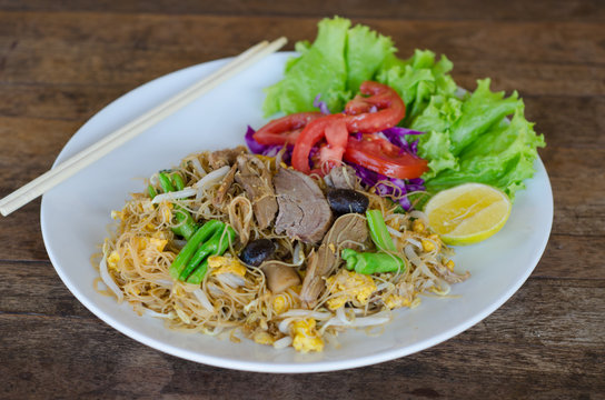 Thai style stir fried rice noodle with duck and vegetable