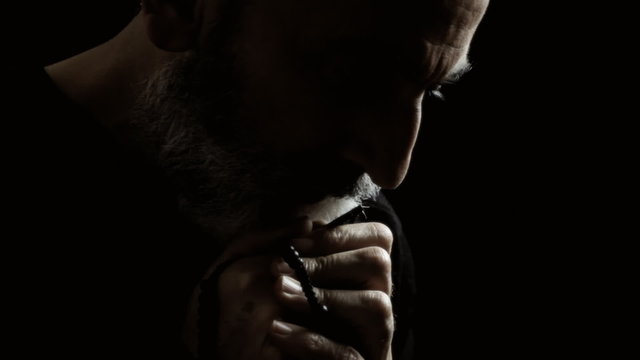 Religious man praying crisis
