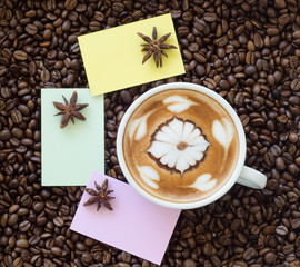 Closeup of a beautiful cup of hot coffee on coffee bean backgrou