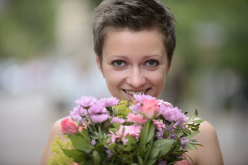 Happy woman holding boquet