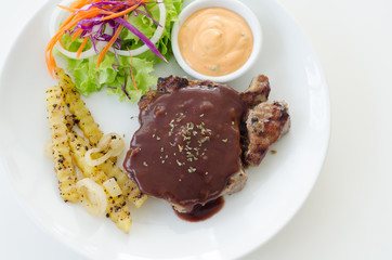 Meat steak with sauce and salad