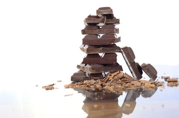 Stack of chocolate on reflective glass