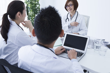 Three doctors have been talking with a smile