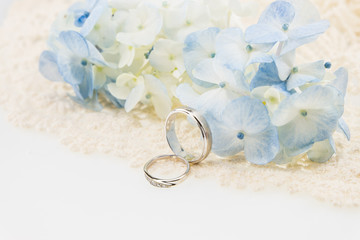 wedding ring with blue hydrangea on  ivory lace