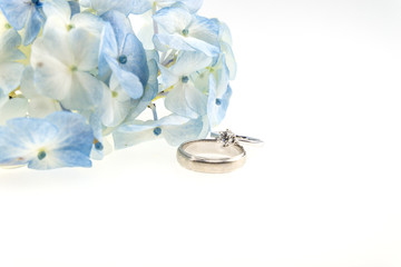 wedding ring with blue hydrangea on white background