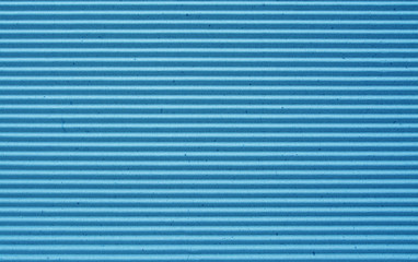 blue corrugated paper background.
