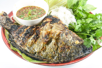 Tilapia grilled with  vegetable isolate on white