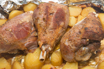 Dinner with baked in foil thigh turkey and potatoes