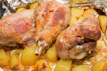 Dinner with baked in foil thigh turkey and potatoes