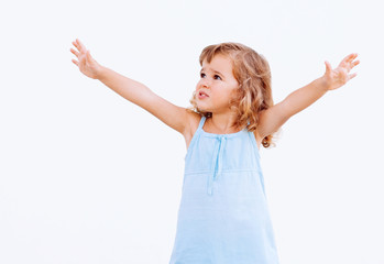 Funny little girl with arms outstretched