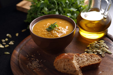 Pumpkin, lentil and carrot soup, bread and olive oil
