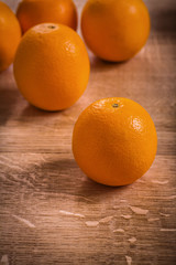 fresh tasty orange fruits on wooden board