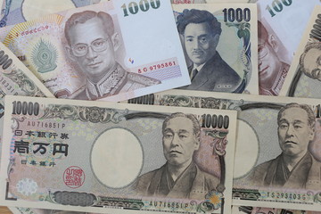 Banknotes of the Japan and Thailand money.