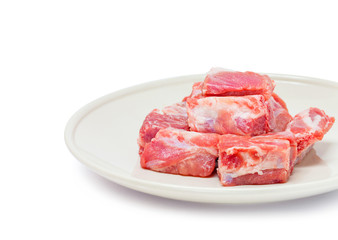 pork sparerib raw in dish isolated on white background