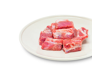 pork sparerib raw in dish isolated on white background
