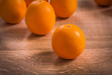 orange fruits on wooden board