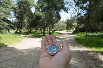 Compass being held out to determine direction