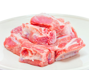 pork sparerib raw in dish isolated on white background