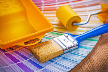 paint brush tray and roller on color palette