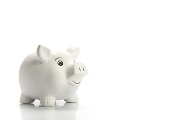 Smiling piggy bank isolated on white
