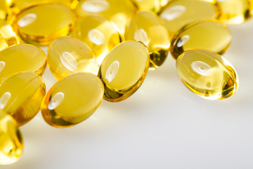 Transparent Vitamins On a White Table