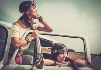 Hippie girls in a van on a road trip