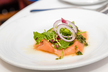 Arugula and Onion on Smoked Salmon